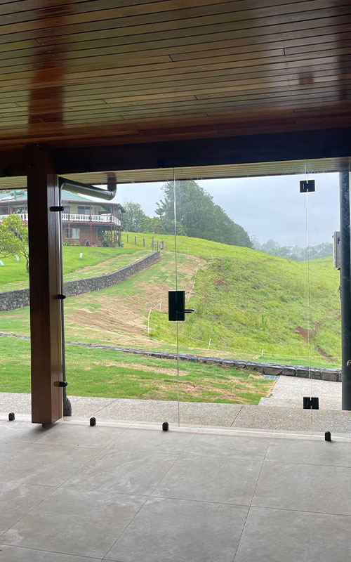 Commercial frameless glass door in the sunshine coast hinterland