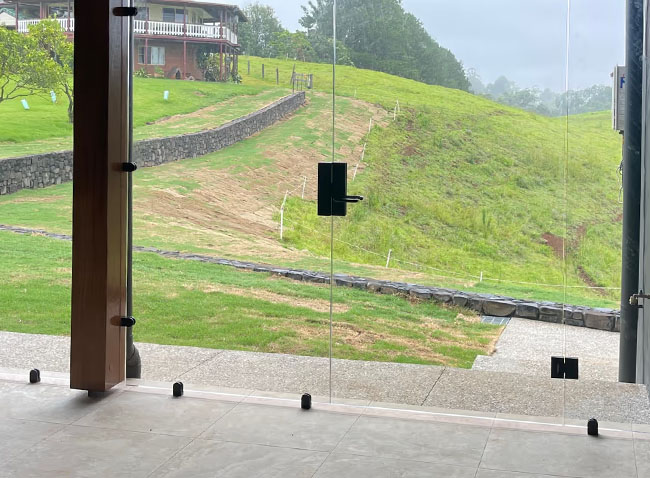 Commercial frameless glass door in the sunshine coast hinterland